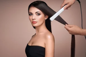 Keratin Glättung Preis München hairdresser straightening long hair with hair iron